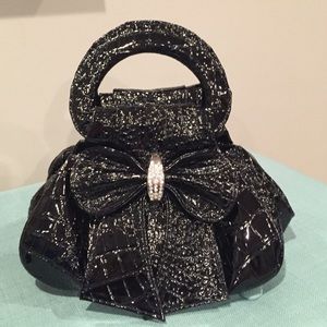 Black alligator skin patent leather clutch