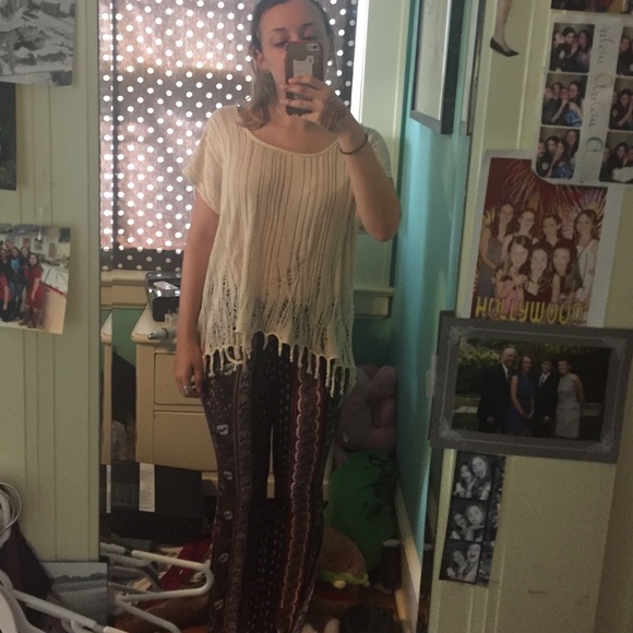 cream distressed short sleeve. fringe bottom