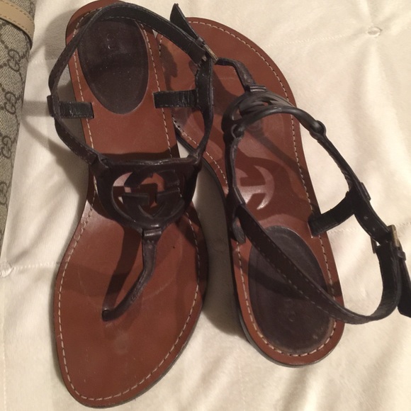 Gucci brown leather interlocking G logo sandals.