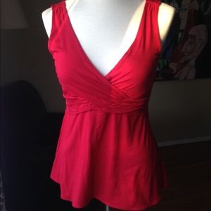 Adorable red sleeveless blouse.