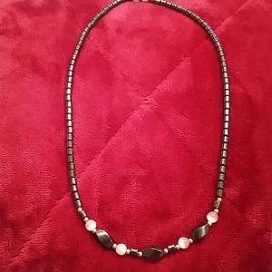 Very pretty pink & black necklace.