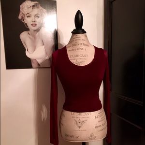Deep red crop top with sheer sleeves
