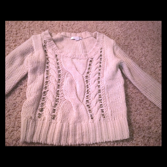 Sweater with chains running through it