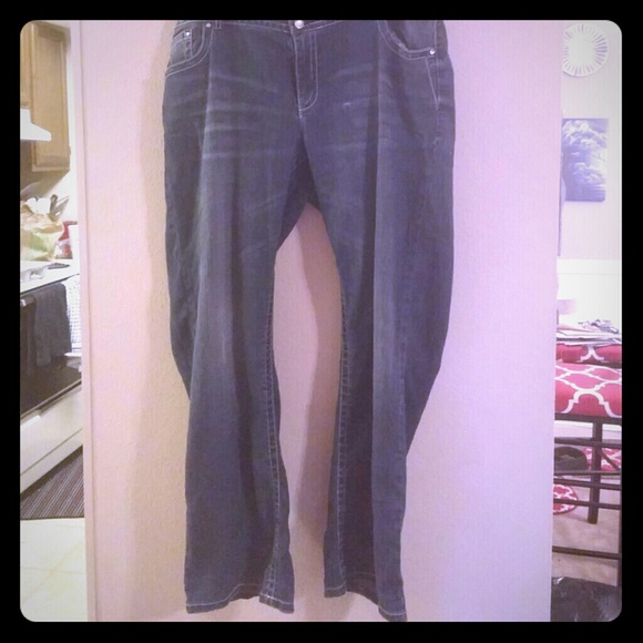 Distressed denim with jeweled butterfly pockets