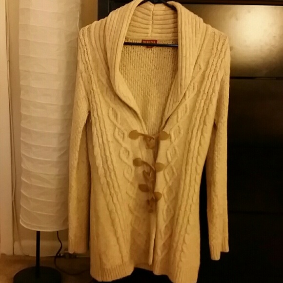 Cream colored long sweater with toggle wood button