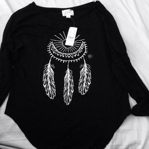 A black shirt with a dream catcher across