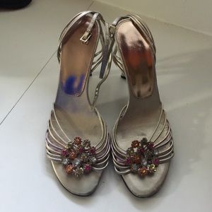 Strapped heels with rhinestone flower charm!