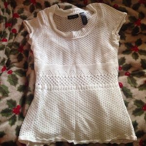 It is Knit White Top/Blouse, 100% Cotton