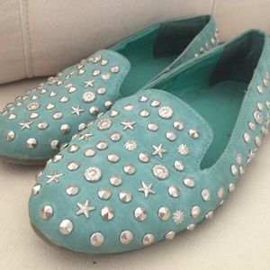 Light blue suede loafers with studs