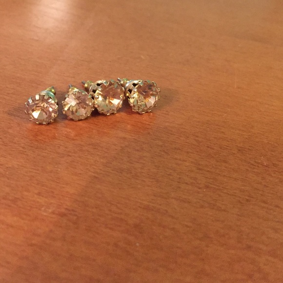 Two pairs of gold colored earrings