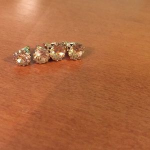 Two pairs of gold colored earrings