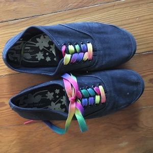 Black tennis shoes with rainbow laces
