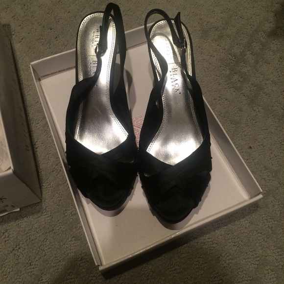 Black open toe sling back heels.