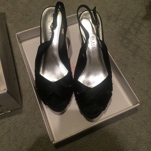 Black open toe sling back heels.
