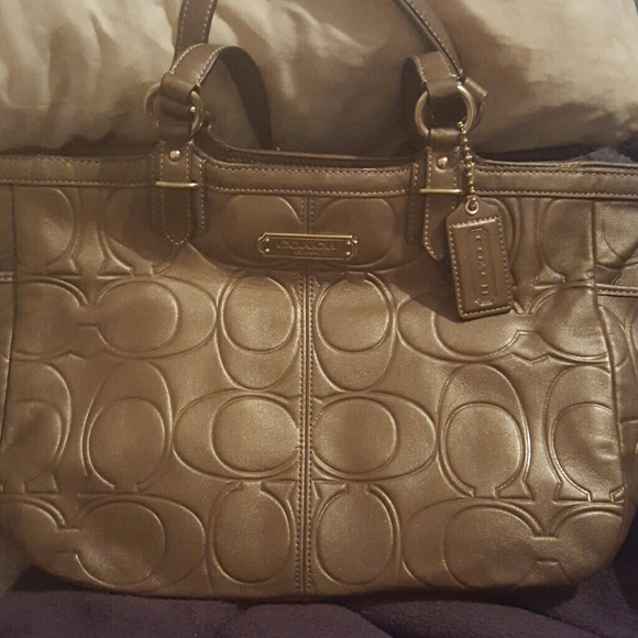 Monogram coach leather handbag.