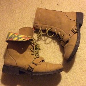 Tan lace up fold over combat boots.
