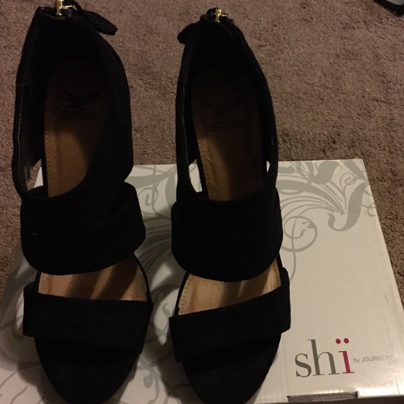 Suede black high heels.