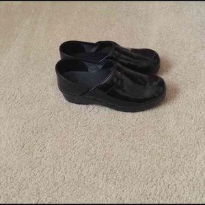 Black patent Dansko work clogs