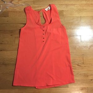 An orange, open back top