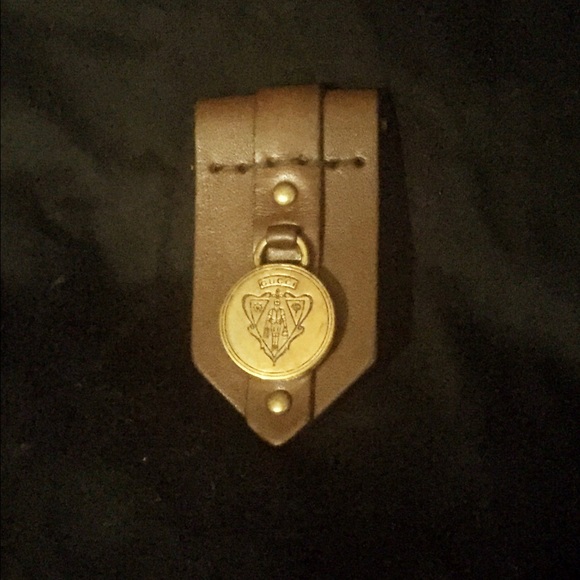Gucci leather and brass pin