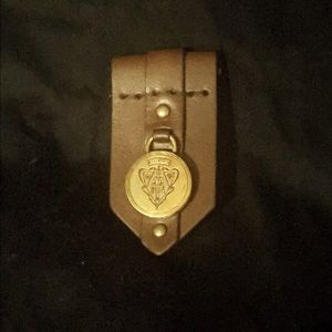 Gucci leather and brass pin