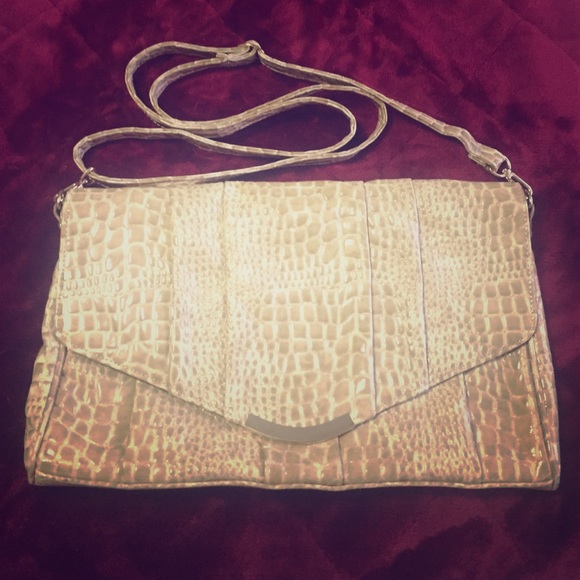 tan snake style handbag