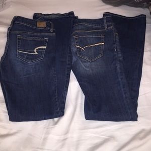 Two pairs dark wash boot cut jeans