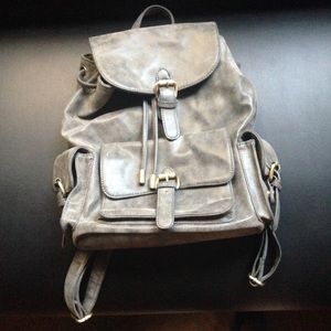 Vegan leather gray rucksack with lots of pockets