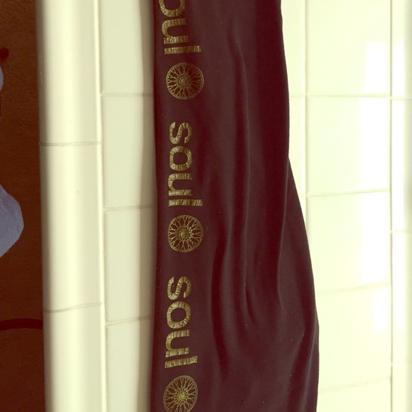 SoulCycle leggings w/ gold soul and wheel repeat