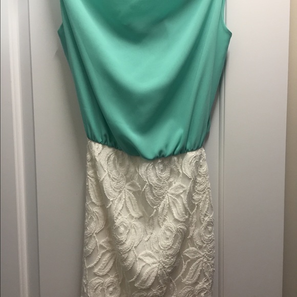 Swoop neck dress with crisscross back.
