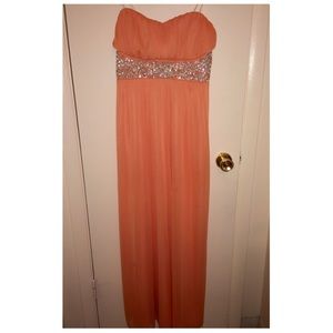 Only wore once and is tailored at bottom