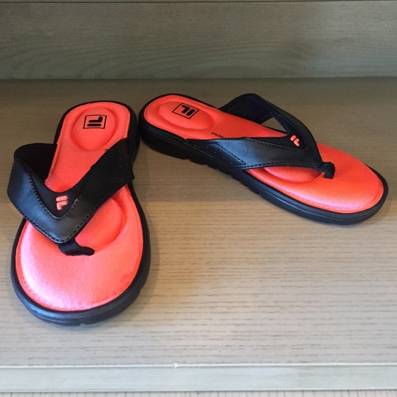 Orang and black flip flops