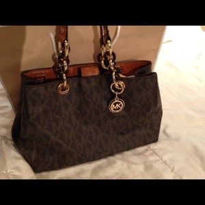 Michael Kors " Cynthia" signature brown.