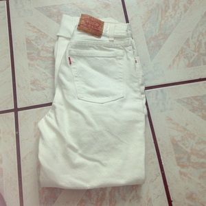 All white ripped high waisted levi jeans