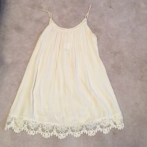 Cream spaghetti strap dress with lace bottom