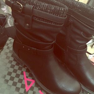 Black boots with Silver detailing and knit tops.
