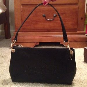 Coach horse and carriage shoulder bag.
