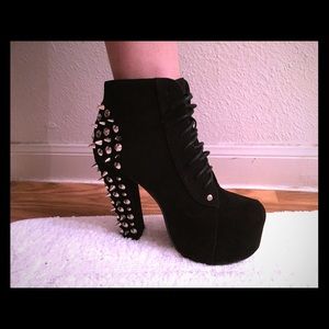 A cute black pair of studded heel boots.