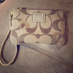 Gold coach wristlet