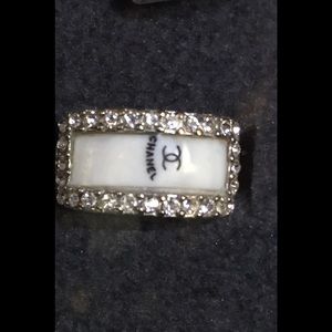 Silver ring with Chanel logo on front
