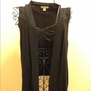 Black open vest.