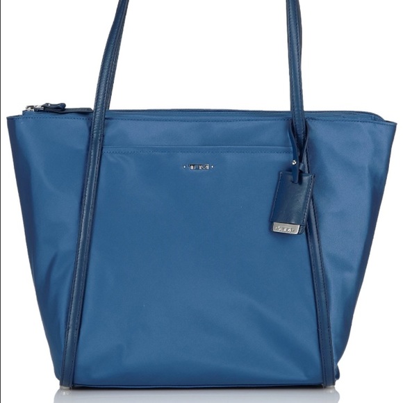 TUMI - brand new messenger bag. Amazing price