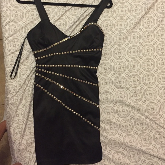 Black mini bebe dress size 0, hugs body