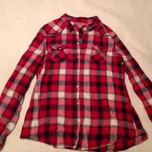 Red, white, and black flannel shirt.