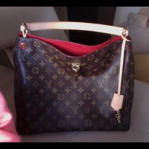 Like new Louis Vuitton Gaia bag. Only worn twice!