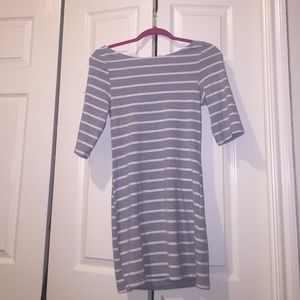 Short grey and white striped dress .