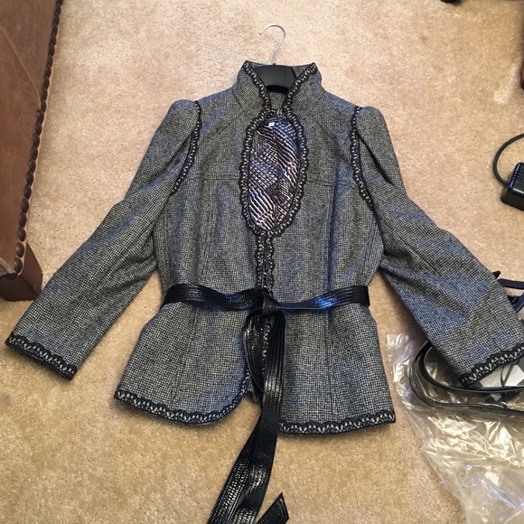 Andrew GN. Skirt suit with 2 belts.