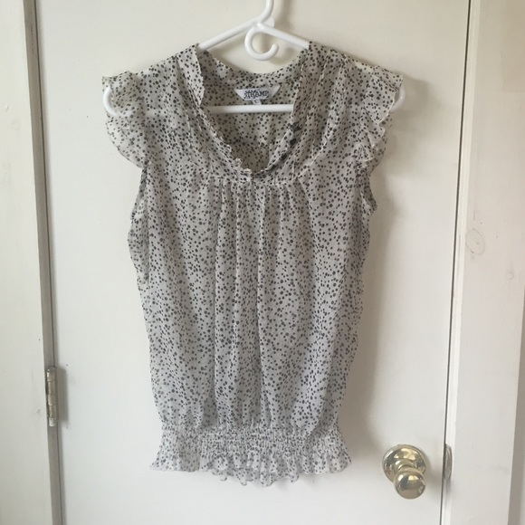 Sheer black and white top with ruffle sleeves
