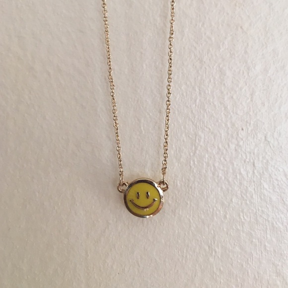 A happy face necklaces with the tag on!