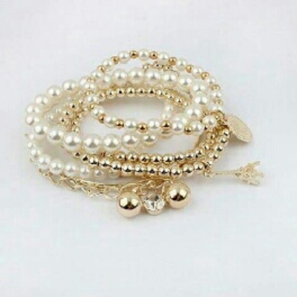 Deb Jewelry - Faux pearl decorated star pendant charm bracelet??